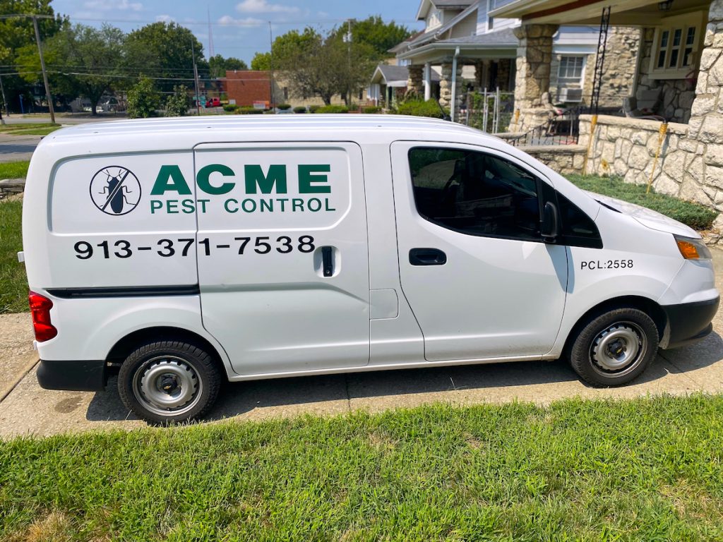 Acme Pest Control Vehicle outside of a home.